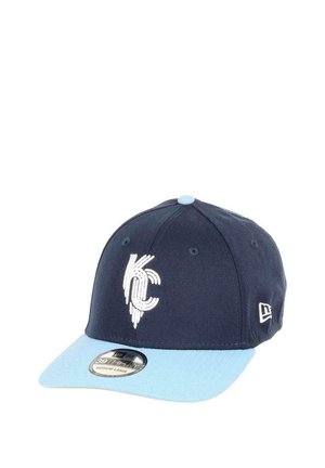 Navy blue cap with light blue visor, featuring a white KC logo on the front. Made from fabric with a smooth texture, structured design.