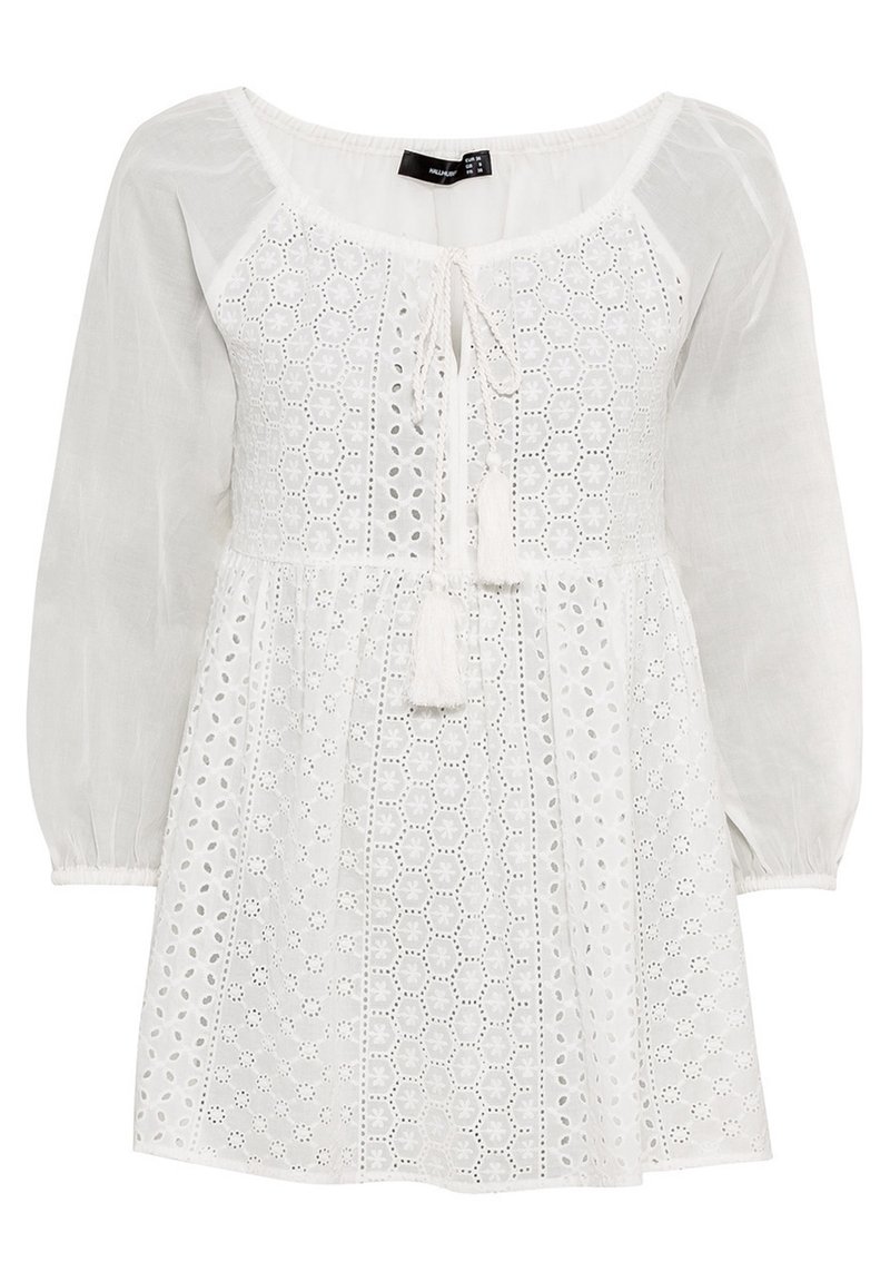 White dress with a textured, embroidered bodice featuring hexagonal cut-outs, a tie detail at the neckline, and sheer long sleeves.