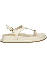 Sandalo in pelle color crema con design a T-strap, fibbia regolabile e suola piatta caratterizzata da un dettaglio intrecciato sui bordi.