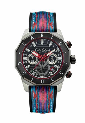 Octagonal watch with black dial, silver and red accents. Features chronograph sub-dials, colorful patterned strap with blue, red, and purple hues.