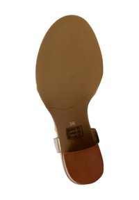 Light brown shoe sole with a rounded shape, featuring a textured surface, size 36 marking, and smooth sides.