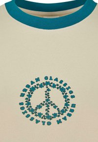 Beige short-sleeve T-shirt with a teal ribbed neckline and a peace symbol design, surrounded by floral accents and the text "URBAN CLASSICS."