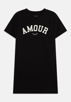 Black cotton t-shirt with short sleeves and round neckline. Features "AMOUR" in large white letters across the chest, below a graphic detail.