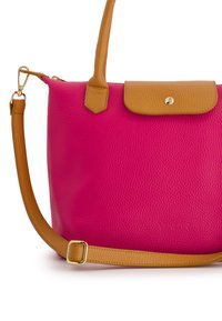 Pink leather handbag with a textured finish, featuring a brown top flap and shoulder strap with a gold clasp. Compact and structured design.