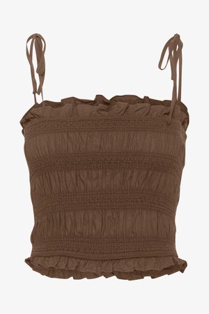 Rudas, susiūtas trumpas viršus su raukšlėtu apykakle ir reguliuojamomis juostelėmis. Pagamintas iš minkštos medžiagos, turi horizontalią tekstūrą ir dekoratyvines volangėles.