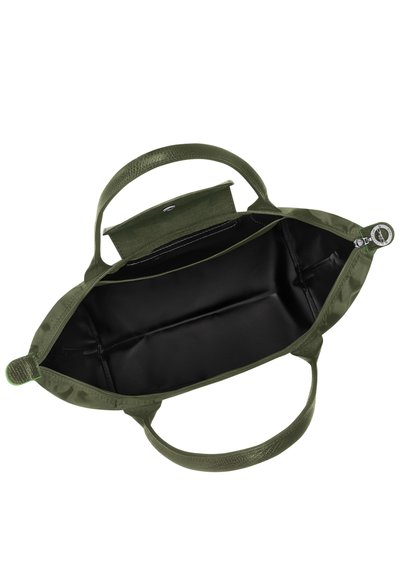Olive green handbag with textured material, dual handles, magnetic snap closure, and a sleek black interior with compartments.
