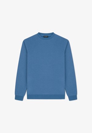 Niebieska bluza z długim rękawem i okrągłym dekoltem, z prążkowanymi ściągaczami na mankietach i dole, ułożona na płasko na białym tle.