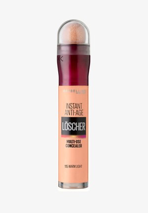 Maybelline Instant Anti-Age Multi-Use Concealer in 115 Warm Light. Cilindrische fles met een roze en perzik ontwerp en een afgeronde, pluizige applicator.