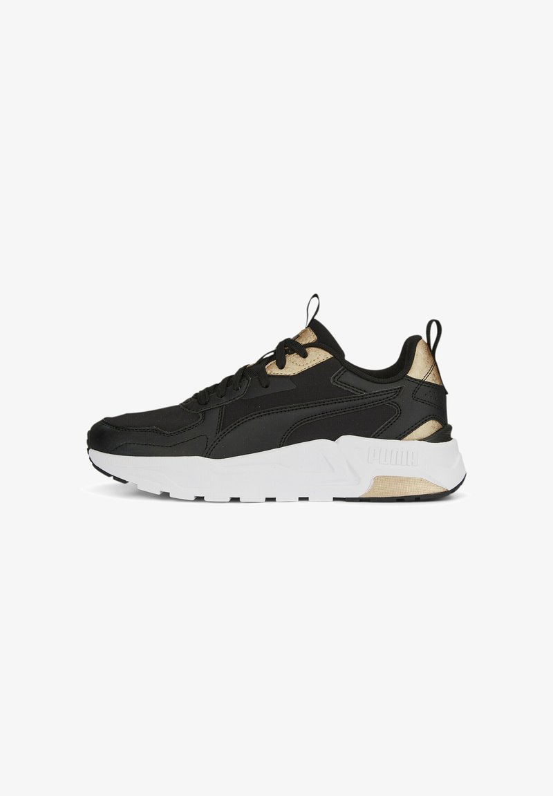Black athletic sneaker with gold accents, featuring a chunky white sole, textured overlays, and traditional lace-up design.