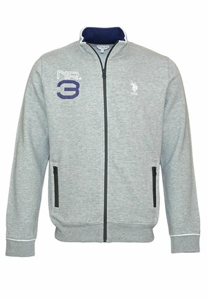 Šedá zipová mikina z texturované tkaniny. Obsahuje námořnický límec, vyšívané číslo "3" a logo. Má také dvě kapsy na zip.