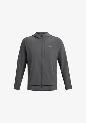 Pelēka jaku ar rāvējslēdzēju un kapuci, izgatavota no viegla materiāla. Ar Under Armour logo un divām priekšējām kabatām. Gluda tekstūra, sportisks piegriezums.
