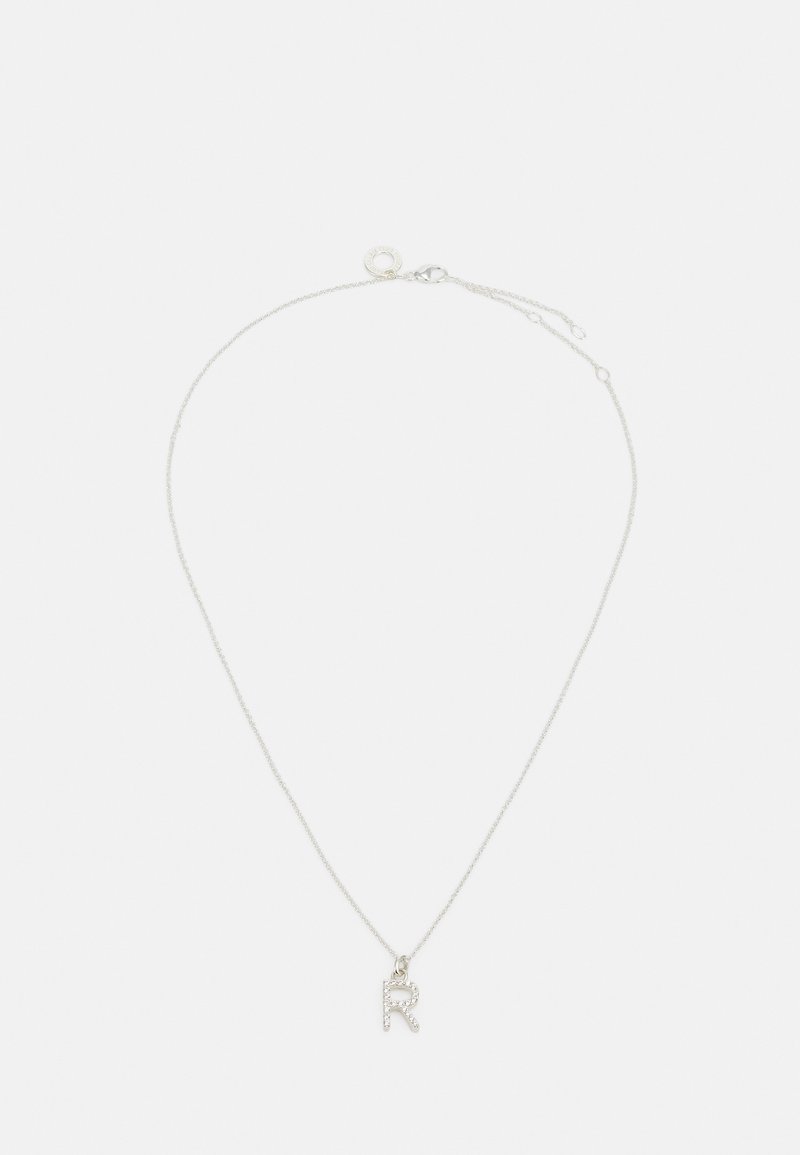 Silver chain necklace featuring a pendant shaped like the letter "R," embellished with small, clear gemstones.