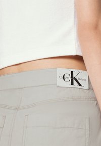Calvin Klein Jeans WRAP ZIPPED SKIRT - Μίνι φούστα - eggshell