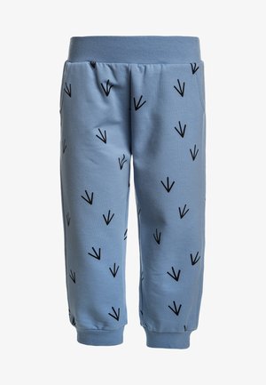 Pantaloni della tuta per bambini di colore azzurro chiaro con motivi a impronte di uccelli nere, vita elastica, tasche laterali e polsini alle caviglie.