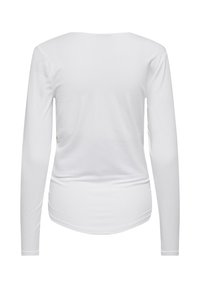 White long-sleeve shirt made from soft cotton. Features a round neckline and a curved hemline with a smooth, plain texture.