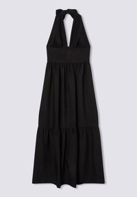 Abito nero senza maniche realizzato in tessuto morbido. Presenta un corpetto aderente e una gonna a strati. Mostra un dettaglio del collo legato e una silhouette fluida.