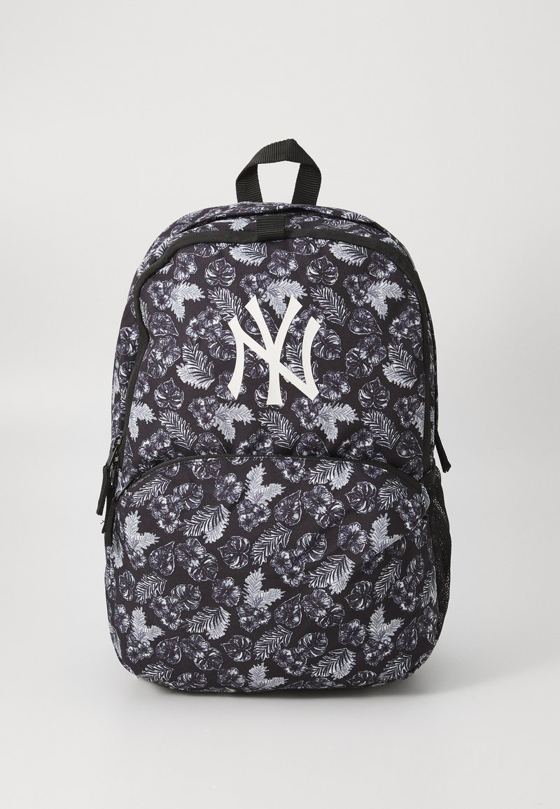 Black backpack with a floral pattern featuring white leaves, a white NY logo at the center, and a front zip pocket with mesh sides.