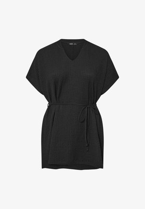 Mustatunika, jossa on V-kaula-aukko ja lyhyet hihat, tekstuurinen kangas, väljä istuvuus ja vyö vyötäröllä.