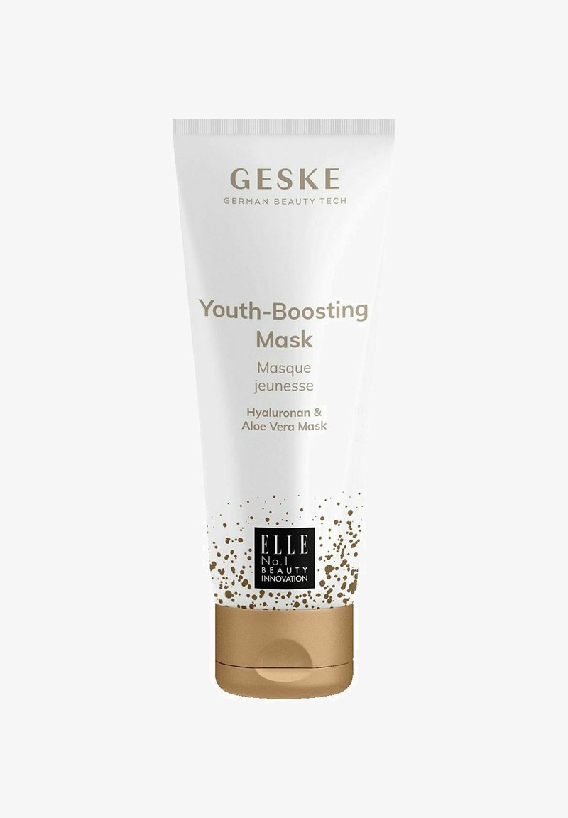 White tube with gold accents, labeled "Youth-Boosting Mask." Contains hyaluronic acid and aloe vera, featuring a speckled pattern.
