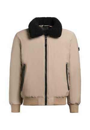 Beżowa kurtka typu bomber z czarnym kołnierzem ze sztucznego futra, zamkiem z przodu oraz bocznymi kieszeniami. Miękka w dotyku, z ściągaczami na mankietach i u dołu.