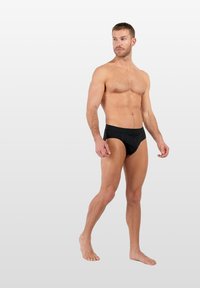 Schwarze Badebekleidung im Brief-Stil aus glattem, dehnbarem Stoff. Verfügt über einen mittelhohen Bund und einen figurbetonten Schnitt, geeignet zum Schwimmen.