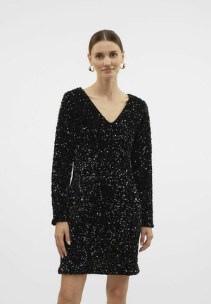 Robe noire en sequins avec décolleté en V, manches longues et silhouette ajustée. La texture est étincelante et réfléchissante, mettant en valeur le design.