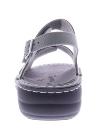 Gray suede sandal featuring adjustable straps, a cushioned footbed, and a thick, textured black platform sole with white stitching accents.