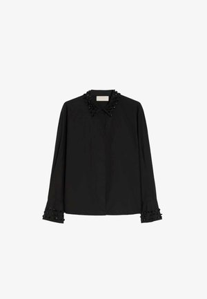 Blusa nera con colletto strutturato decorato con perline. Le maniche lunghe presentano dettagli decorativi di perline sui polsini. Tessuto dalla texture liscia.