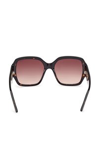 Lunettes de soleil carrées surdimensionnées avec montures écaille de tortue et verres bruns dégradés vues de face.