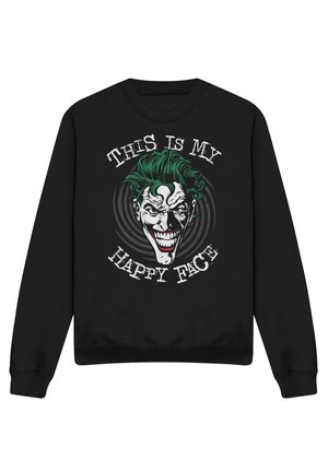 Schwarzer Sweatshirt mit einer Grafik eines grünhaarigen, grinsenden Gesichts und Text darüber und darunter mit dem Schriftzug "This is my happy face."