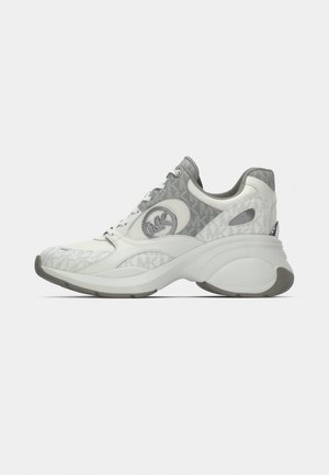 Balts sporta apavi ar teksturētu rakstu, pelēkiem akcentiem un redzamu logotipu sānos. Bieza zole ar apaļu formu.