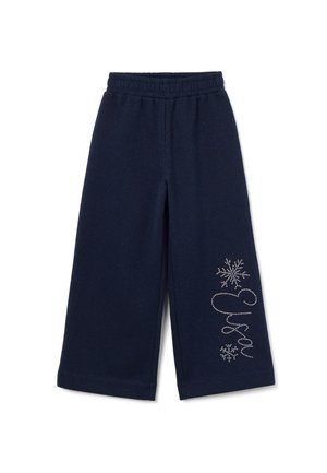 Pantalons larges bleu marine avec une taille élastique, présentant des accents en argent scintillant de flocons de neige et de texte sur le bas à gauche. Texture de tissu douce.