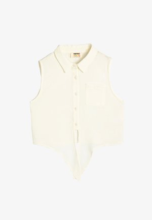 Mouwloze, crèmekleurige overhemd met kraag en knoopsluiting, een enkele borstzak en een gebogen zoomontwerp. Zachte stoftextuur.