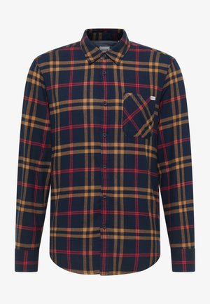 Ruuduline särk tumesinisel, punasel ja liivakarva toonis; puuvillane materjal; nööpidega kinnitatav disain pikki varrukatega; rinnatasku; ruuduline muster kontrastsete triipudega.