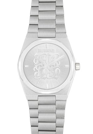 Silver watch with a textured stainless steel band, octagonal case, and engraved dial featuring stylized lettering. Subtle brushed finish throughout.