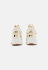 MICHAEL Michael Kors DARBY WEDGE TRAINER - Trainers - cream