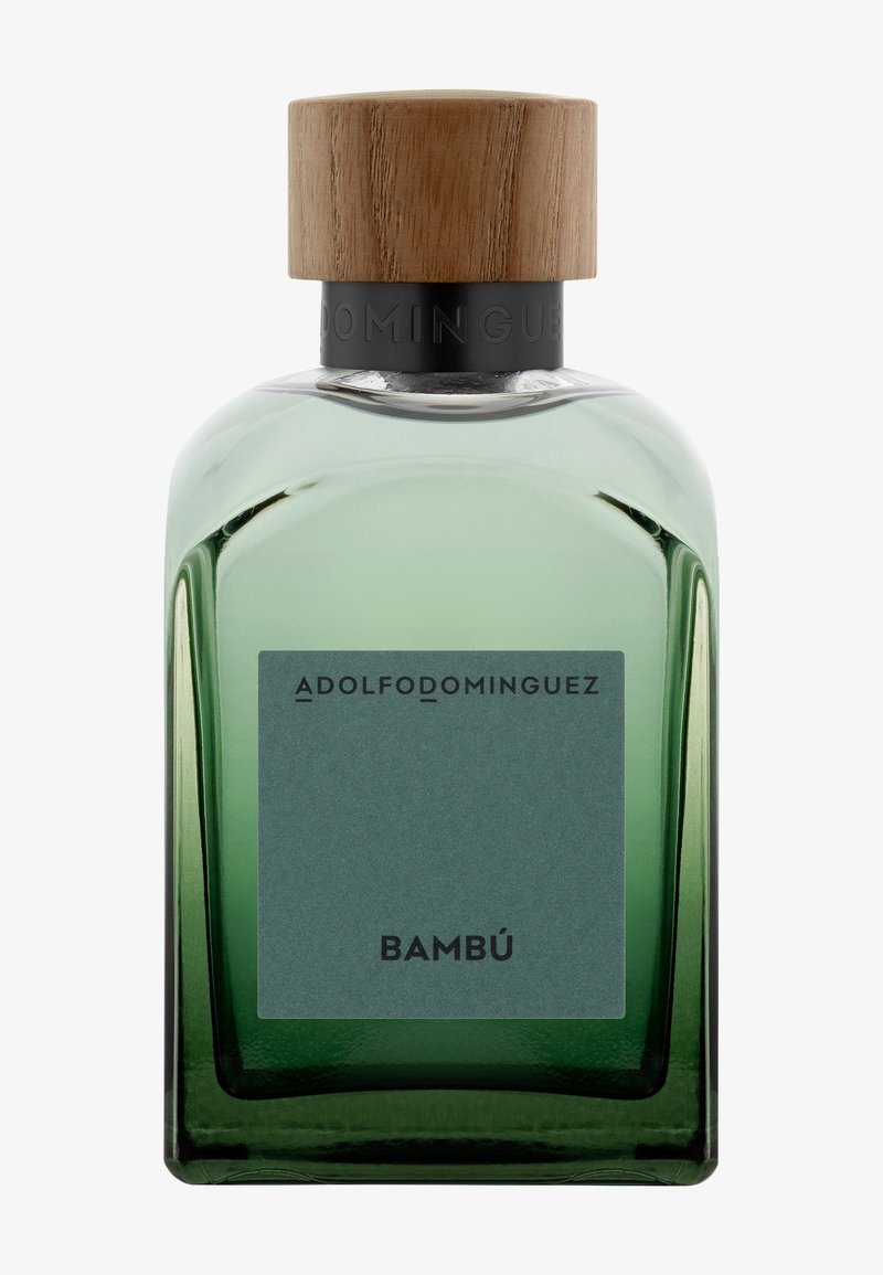 Flacon de parfum en verre teinté vert avec bouchon en bois, étiqueté "Adolfo Dominguez" et "Bambú" à l'avant.