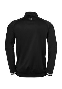 Black sports jacket with long sleeves, high collar, and a fitted design. Features subtle texture and 'K' logo on the back.