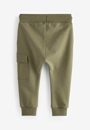 Olivno zeleni trenirki z rebrastim pasom in manšetami na gležnjih. Ima stranski žep za tovor in mehko, strukturirano tkanino.