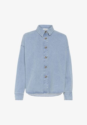 Gai zila džinsa krekls ar izkliedētu apkakli, garām piedurknēm un pogām priekšpusē, kam ir metāla pogas un brīva piegriezuma siluets.