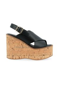 Sandali con tacco in pelle nera con piattaforma in sughero, design open-toe, cinturino alla caviglia regolabile con fibbia dorata, dettagli in sughero testurizzato.