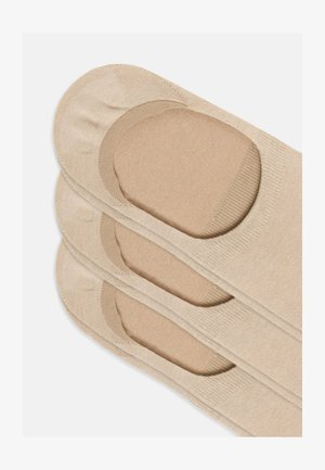 Chaussettes invisibles beige avec une texture lisse, dotées d'une zone de coussin au niveau des orteils et d'un haut élastique pour un maintien sécurisé. Conçues pour être portées discrètement.