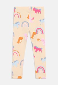 Legginsy w jasnym beżu z kolorowymi rysunkami dinozaurów i jednorożców, z tęczowymi wzorami oraz różowymi, niebieskimi i pomarańczowymi akcentami.