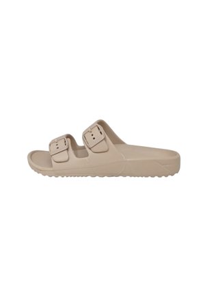 Sandalo beige open-toe tipo slide con due cinturini regolabili con fibbia e suola testurizzata per una migliore aderenza, visto di lato.