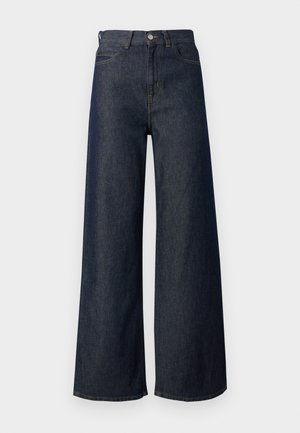 Τζιν παντελόνι με φαρδύ μπατζάκι και ψηλή μέση, με σχέδιο πέντε τσεπών, χρυστό ράψιμο και μεταλλικό κουμπί. Λείο υλικό συνολικά.