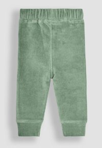 Groene corduroybroek met een elastische tailleband, met ribbelstructuur en aansluitende boorden bij de enkels.