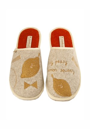 Beige felt slippers with orange insoles, featuring gold embroidery of lemons and playful text "easy peasy lemon squeezy" on the upper.