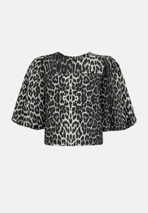 Krátky rukáv top v čierno-bielom leopardom vzore, s boxy strihom, zviazanými detailmi na pleciach a hladkou textúrou látky.