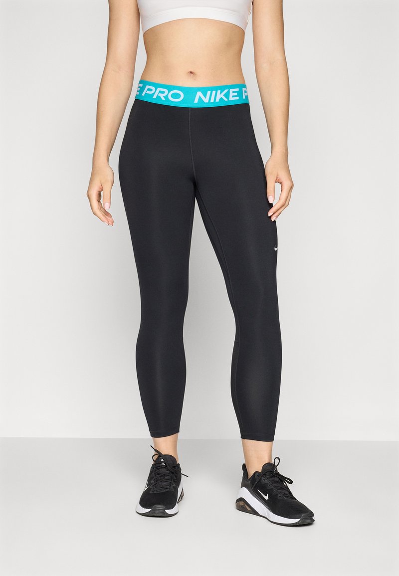 Black athletic leggings featuring a turquoise Nike Pro waistband, made of stretchy material, with a slim fit and no visible patterns.
