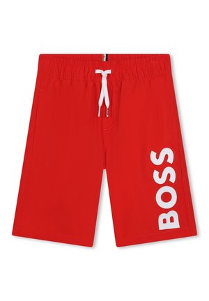 Shorts de bain rouges avec une taille élastique, un cordon blanc, et un grand logo "BOSS" blanc sur le côté gauche. Matière lisse et légère.